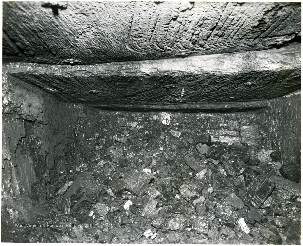 Large chunks of coal piled below the seam.