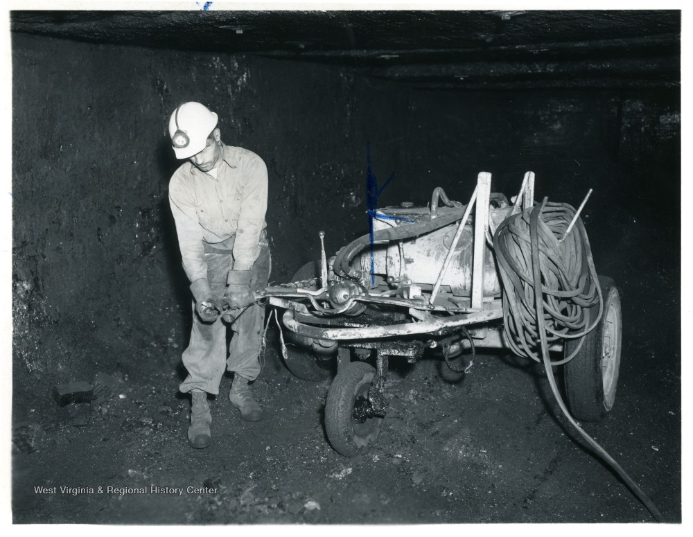 Miner with drilling machine at Jamison No. 9.