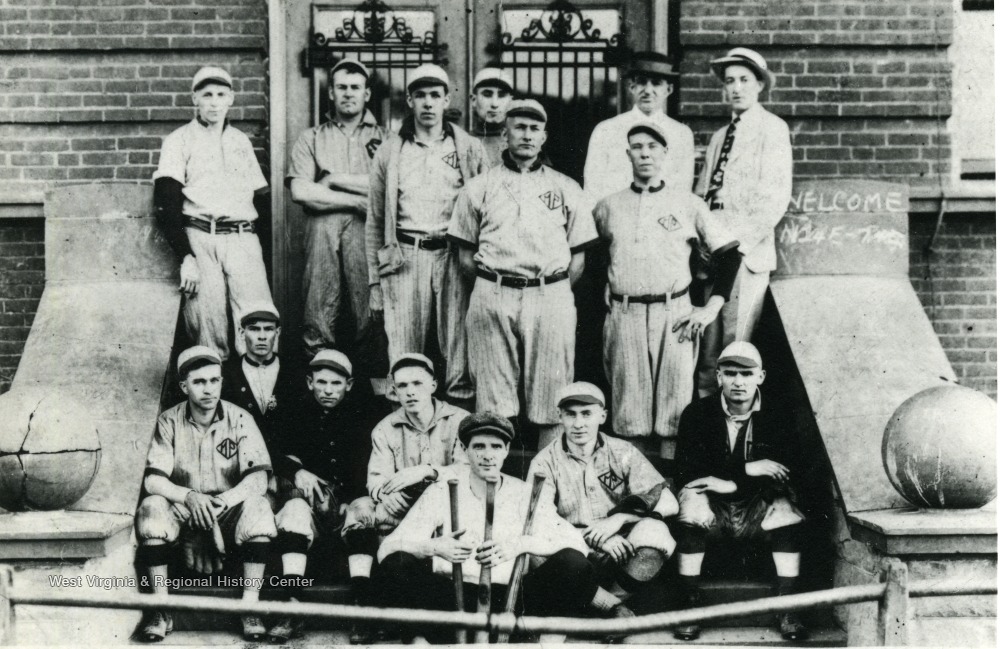 Group portrait of the Spruce Street Methodist Church Baseball Team. Members wearing their uniforms. 