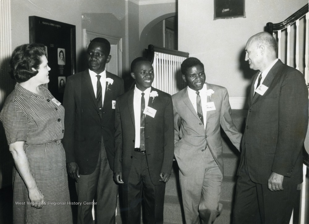 Left to right, Betty Boyd; Unknown; Mr. Munubi; Mr. Masenjo; both students from Zambia; Ernest J. Nesius.