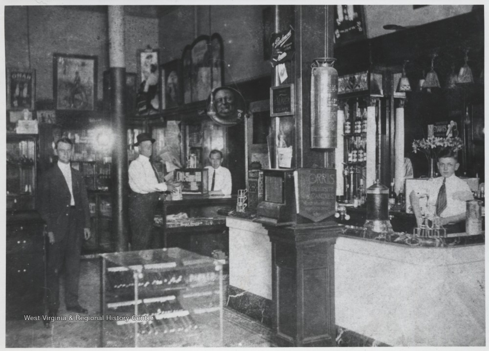 John Rose, Charlie Rose (fountain boy) and Shan Rose (behind counter) pictured inside their store. 