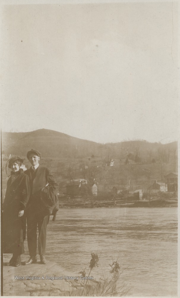 On the back of the photo, the couple is identified as "Young and Lula". The town of Bellepoint is pictured in the background.