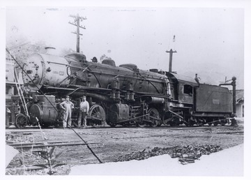 This was the first Mallet locomotive to come up the C and O Greenbrier Division; Notice the carbon arc light with globe suspended above pole behind engine cab. This picture was taken several years after the first run was made in 1905.