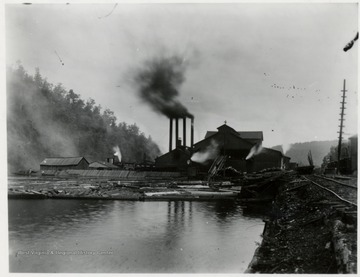 Mill, log pond, and four stacks.  W.Va. Spruce Lumber Co., Cass, W.Va. (Greenbrier, Cheat, and Elk Railroad No. 5) Believed to been at time No. 1503 in operation.