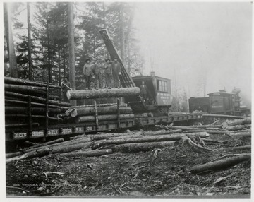 West Virginia Spruce Lumber Co. American Log Loader, Model C, No. 2.  On loader says 'Greenbrier and Elk River Railroad 39' on car.  Says 'Greenbrier and Elk River Railroad' on engine.  Log loader, engineer, John Geraw; Engine 2, engineer Lewis Collins; Fireman, Robert Dean.