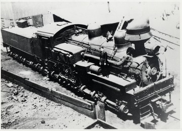 View from coal dock.  John Warner standing on locomotive.