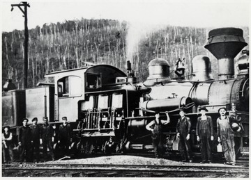 Shay train engine No. 10 and its crew.  (Lima 1914) at Cass.  Spruce, WV. Crew  Ed Lyle - fireman on far right.  Note Lantern on Locomotive.