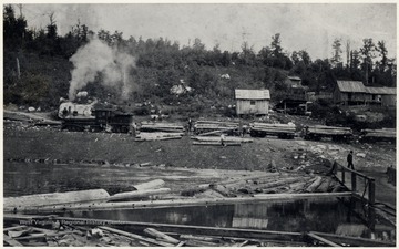 The Jacob L. Rumbarger Lumber Company's Shay locomotive, No. 1 and crew unloading logs.