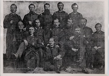 Colonel John H. Oley (later Brevet Brigadier General) and field and staff officers of the 7th West Virginia Cavalry.  Later the regiment was mounted and became the 8th West Virginia Mounted Infantry; early in 1864 the designation was changed to the 7th West Virginia Cavalry.  Officers in picture are:  Left to right, seated - first row - Major Edgar B. Blundon, Lt. Thomas H. Burton, Dr. Louis V. Sanford, and Lt. John McCombs.  Second row - seated - Chaplain Andrew W.? Gregg, Lt. Colonel John J. Posley, Colonel Oley, Major Hedgeman Slack, Lt. John W. Winfield.  Third row - standing - Major William Gramm, Dr. James H. Rouse, Dr. Lucius L. Comstock, Captain Jacob M. Rife, and Lt. D. William Polsley.