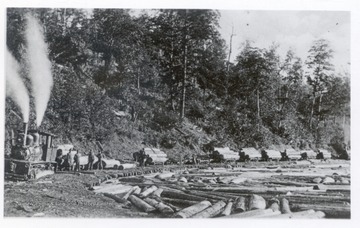 Men unloading logs into log pond at Horton, W.Va.