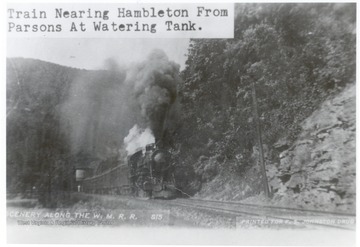 Scenery along the Western Maryland R.R. Train traveling toward Hambleton from Parsons at Watering Tank. Printed for F.S. Johnston Drug.