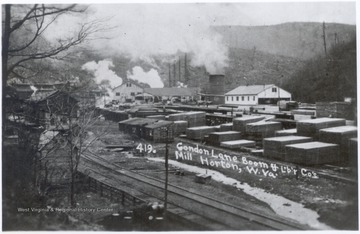 Condon Lane Boom and Lumber Company's Mill at Horton, W.Va.  Lumber piles alongside railroad tracks.