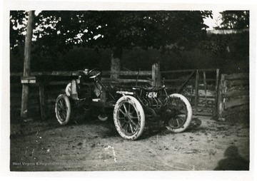Louis Bennett, Jr. driving his car at approximately age 12.  See 'Cross and Cockade Journal' vol. 21, no. 4, winter 80 (West Virginia Collection Pamphlet no. 14277) for an identification on candid portrait of Bennett in car.