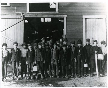Group portrait of boys going home from Monongah Glass Works, Fairmont, W. Va.  Credit National Archives 102-LH-185.<br /><br />