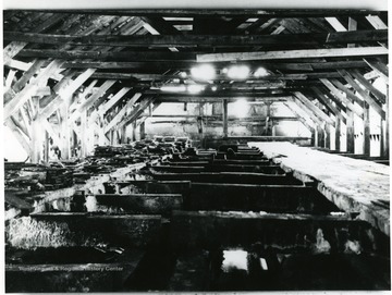 An old method of extracting salt. Salt was lifted out of water and placed on the boards 'walkways' to drain. It was then removed in wheelbarrows for storage.