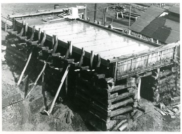 Picture of salt water cistern at Dickinson Salt Works. Brine from all wells is piped to this cistern, which serves as a reserve supply should the wells be shut off for a short time.  The bottom logs in foundation of this cistern were put in about 1870.