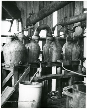 Pipes running into salt jugs.