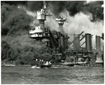 Picture of crew rescuing men of the U.S.S. West Virginia during the attack on Pearl Harbor. Credit Line Navy Department 80-G-19930.
