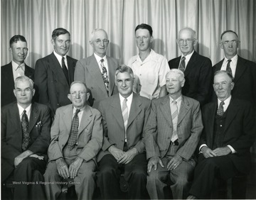 Group portrait of the Directors of the Harrison County Farm Bureau in 1947. Front row 'left to right' - C. M Sperry, President; John Wilcox; J.M Pierpoint, County Agent; Chas. B. Stout; and W. Ira C. Hawker. Back Row: Ernest Huffman, Lewis C. Swisher; Paul S. Horner; John W. Eib, Jr., Vice-President; H. E. Southern; and Jos. G. Lucas.