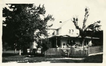 Farm home of W.A. Hively in Dunmore, W. Va. Orginal home consisted of a right wing without a porch.  (See photograph number 001573 to see the home after renovations.)