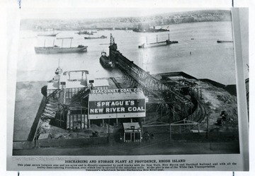 Seaconnet Coal Co., Sprague's New River Coal, discharging and storage plant at Providence, R.I. This plant covers between nine and ten acres and is directly connected by yard tracks with the New York, New Haven and Hartford Railroad and with all the trolley lines entering Providence, over which coal is carried to the suburban mills. At the pier is one of the White Oak Transportation Company's whaleback barges discharging New River Coal.