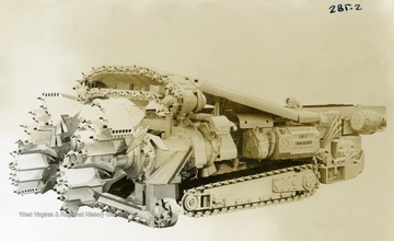 A continuous miner, model 2BT-2 Twin Borer, sits on display.