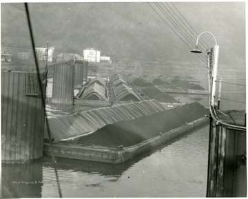 Multiple barges loaded with coal at Star City, W. Va. 