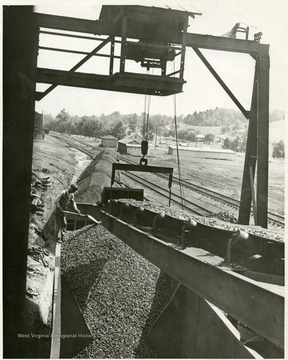 A string of coal cars being loaded.
