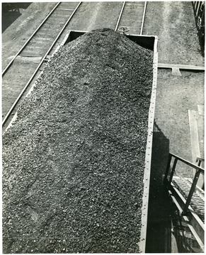 Coal car being filled with coal.