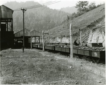 Coal filled mine cars and miners at the Winding Gulf Collieries. Possibly Winding Gulf No. 4.