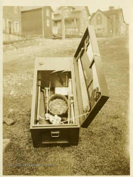 Open box with saw and other implements for use during a mine rescue operation.