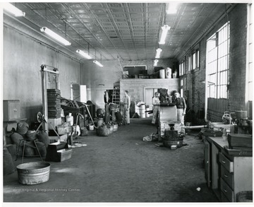Men working in a coal company machine shop.