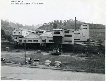 A few men stand outside of processing plant no. 32 at Fairmont W. Va.