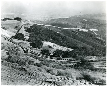 Coal conveyor systems run throughout the hillside.