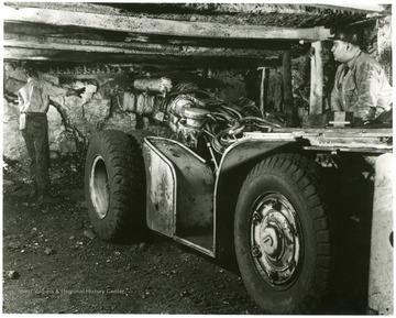 Caption on back reads, 'Making a cut in the coal face is this Mastodon of the machine age - an underground cutter.  Rubber tired for mobility, and mounting a 9-foot cutting blade armed with whirring steel bits, it can cut a full 360 degree arc.  This and similar machines give America's bituminous coal mines almost unlimited capacity for production.'  