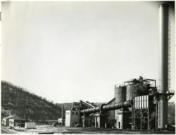 Produced at Mountaineer Carbon Company, high purity electrode carbon is being used for anode or for graphitized electrodes. The plant was designed by Ford, Bacon and Davis, Inc using process data delivered by Petrocarb Equipment Co., Inc. and the Consolidation Coal Company. The Mountaineer Carbon Company was formed in 1956. The raw material-coke was recieved from Sohio's and other refineries and also was present at the plant's site (green petrolum coke).<br />