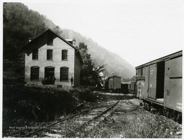 Men standing outside of the Fire Creek Mine Store.