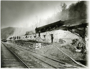 Men standing on top of the coke ovens at Caperton, W. Va.