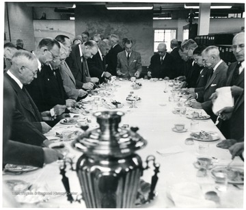 Group of officials at dinner table during a Consolidation Coal Co. Inspection trip.