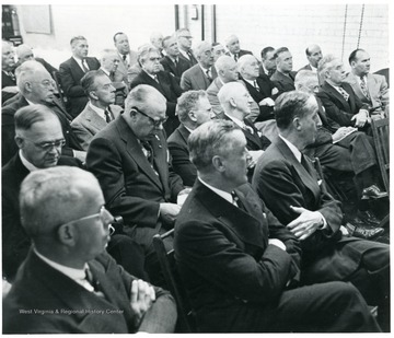 Group of coal officials sitting in chairs during a Consolidation Coal Co. Inspection trip.