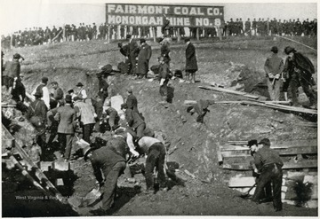 Men helping shovel dirt after the Mine No. 8 disaster. 