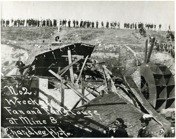 People standing on hill overlooking what used to be the fan and fan house at Mine No. 8.