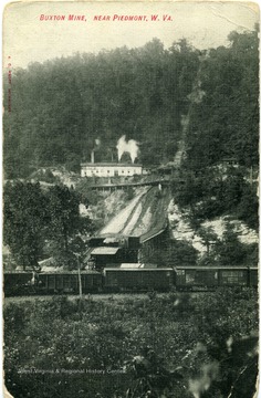 Postcard showing train cars and facilities at the Buxton Mine near Piedmont, W. Va. Message on back is as follows: 'My Dear Mrs. Hardesty, I was mighty glad to get your postal. Came again. I'm spending this Thanksgiving in Piedmont. Came down here last evening. With lots of love, Ed Shelb Varne.'