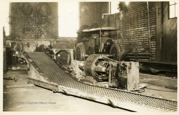 Close view of a conveyor and engine.