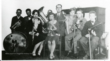 Group of people with instruments. 'Many NRC towns had own orchestras.'