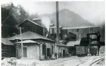 Men stand in front of the tipple and power house at the Great Kanawha Mine, Great Kanawha Colliery Co., Kanawha County.