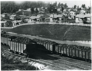Railroad in front of a mining community.