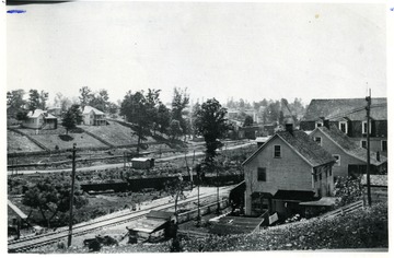 Houses around a railroad in a mining town. Mabscott and Wickham workers were close neighbors.