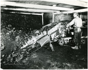 Miner operating a loading machine.