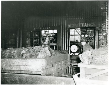 Miners and filled coal cars at the Scale House, Crane Creek Mine.